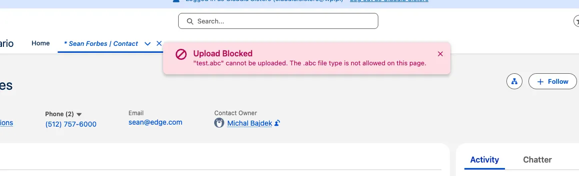 Upload blocked toast naming the file and the reason